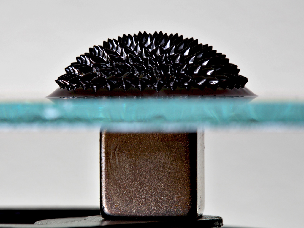 Ferrofluid and magnet, separated by glass. ( The Basics of Ferrofluids )