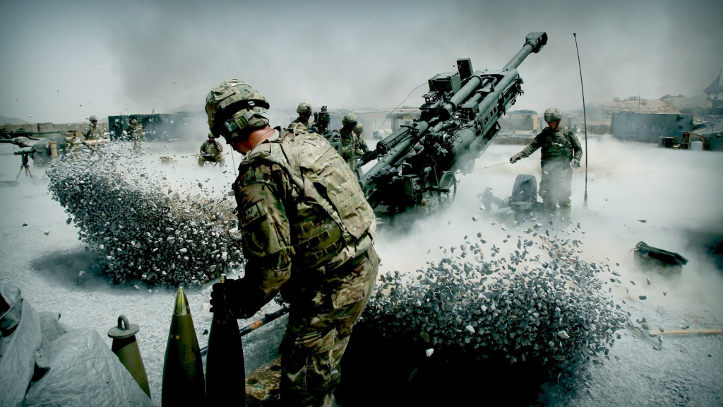 US Soldiers with an ISAF (International Security Assistance Force) component man a M777 towed 155mm Howitzer artillery piece. ( Trajectories & Howitzers )