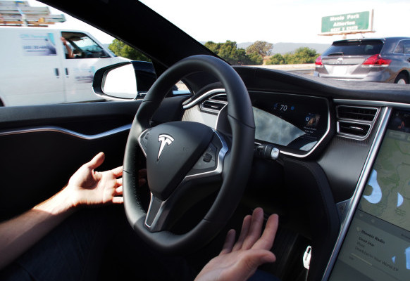 Demonstrating Tesla's new Auto Steer and Land Change features